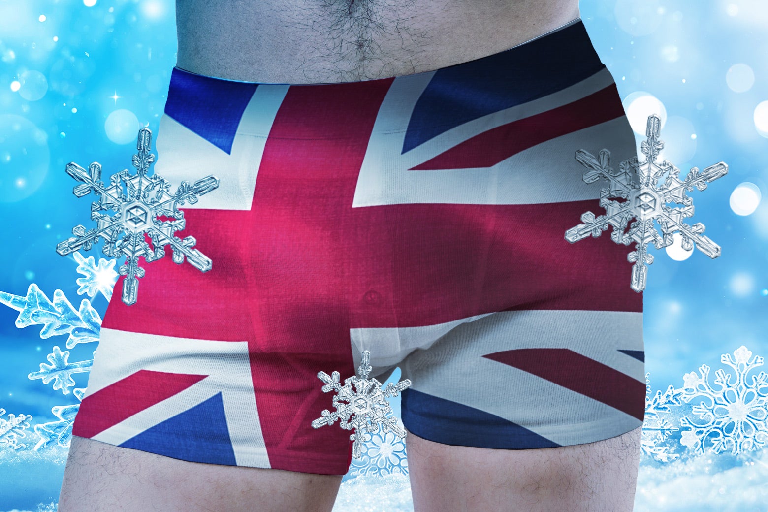 A man as seen from the hips, wearing Union Jack–patterned boxers, surrounded by snowflakes and other signs of cold.