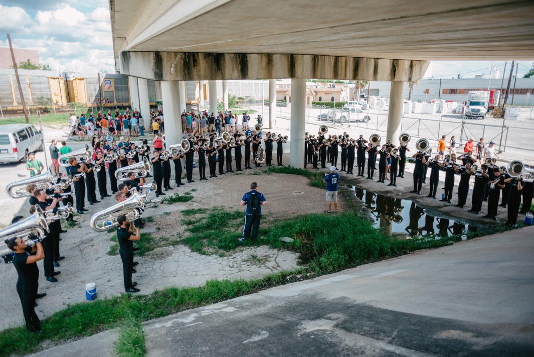 Underpass Warm-up. The Blue Knights Drum & Bugle Corps rehearse beneath an underpass at the DCI Southwestern Championship, The Alamodome, San Antonio, Texas