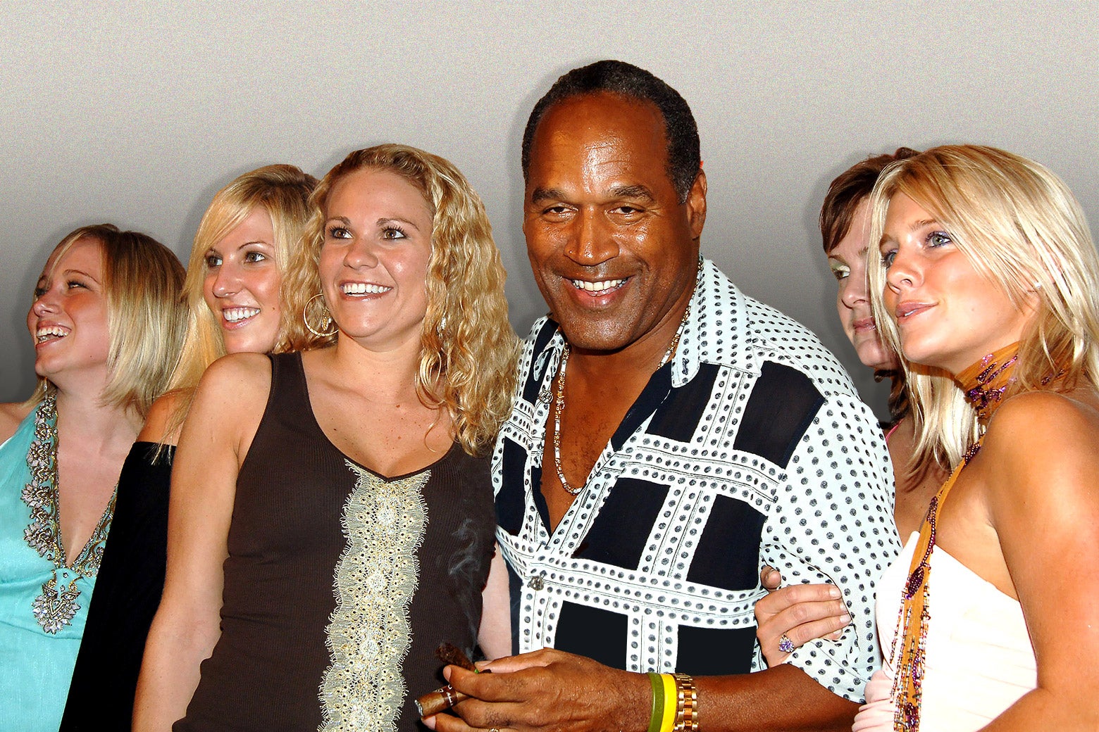 A photo of O.J. Simpson holding a cigar, surrounded by white women.