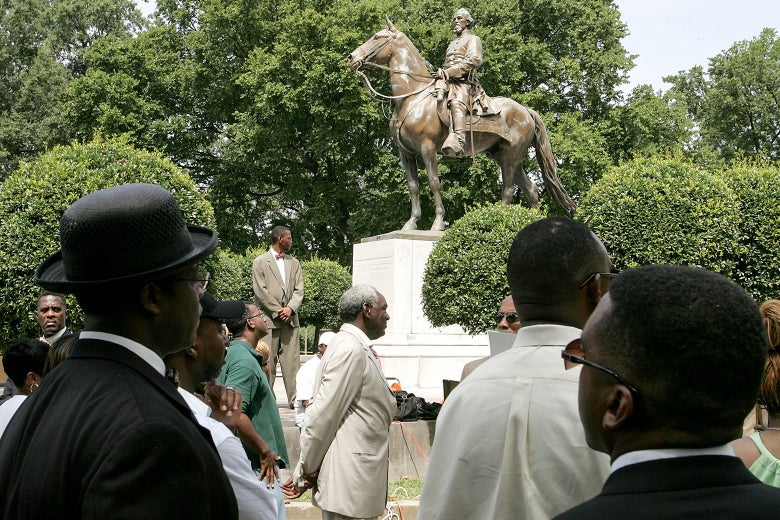 Protesters attend a rally  against the name of Nathan Bedford Forrest Park in front of a statue bearing his likeness Aug. 13, 2005, in Memphis, Tennessee.