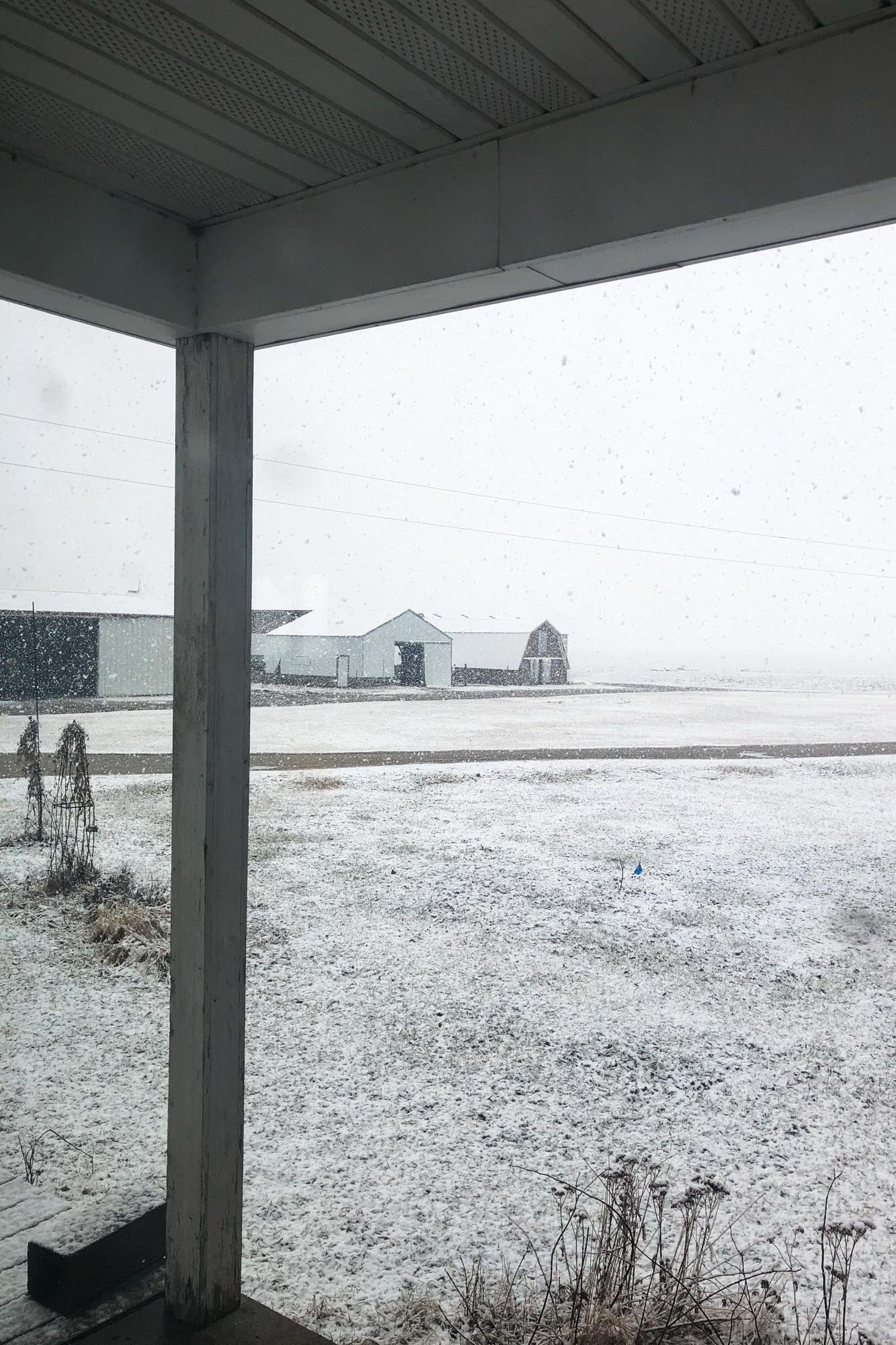 A farm field covered in snow.