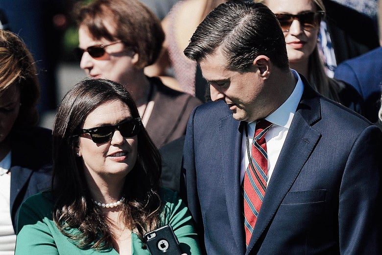 Press Secretary Sarah Huckabee Sanders and former White House Staff Secretary Rob Porter prepare to observe a moment of silence at White House on Oct. 2 in Washington.