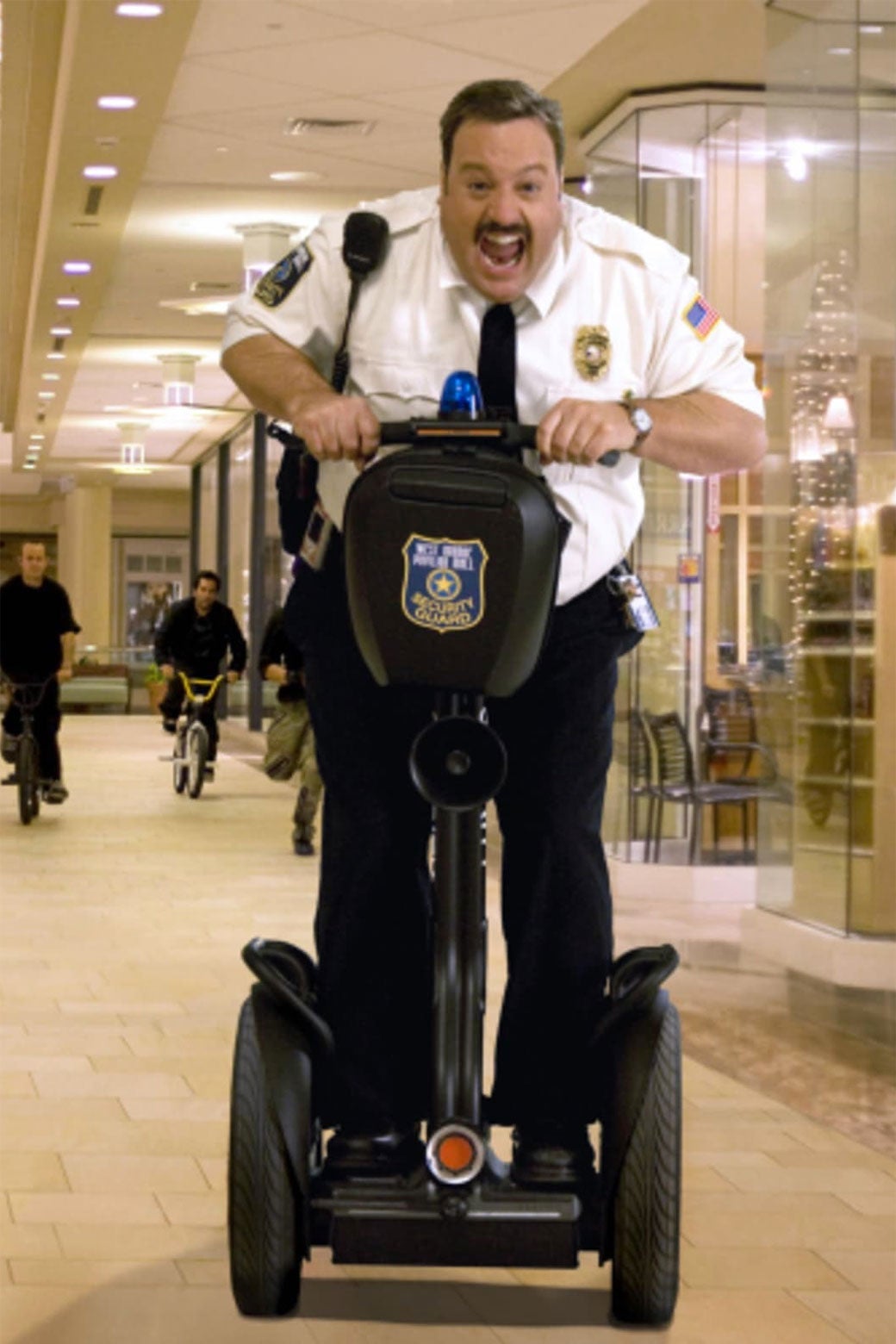 Kevin James rides a Segway in a scene from Paul Blart: Mall Cop.