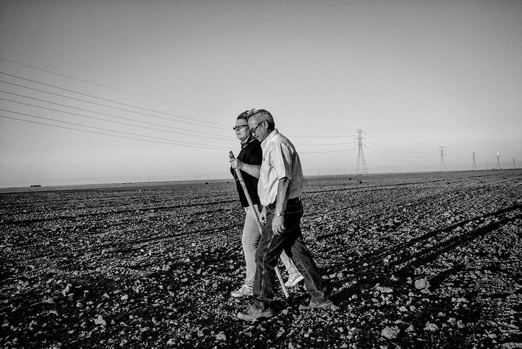 Sharon and David Wakefield in fallowed farmland near their home.