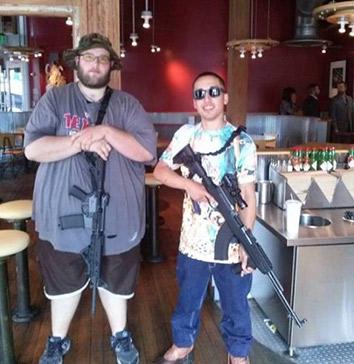 Members of the gun rights group Open Carry Texas pose in a Chipotle restaurant.