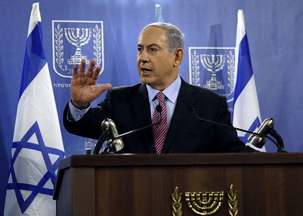 Israeli Prime Minister Benjamin Netanyahu speaks to the press at the Defense Ministry in Tel Aviv on July 22, 2014.