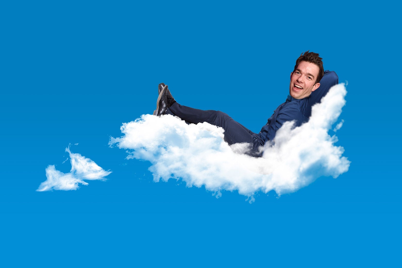 A photo illustration of John Mulaney resting on a cloud.