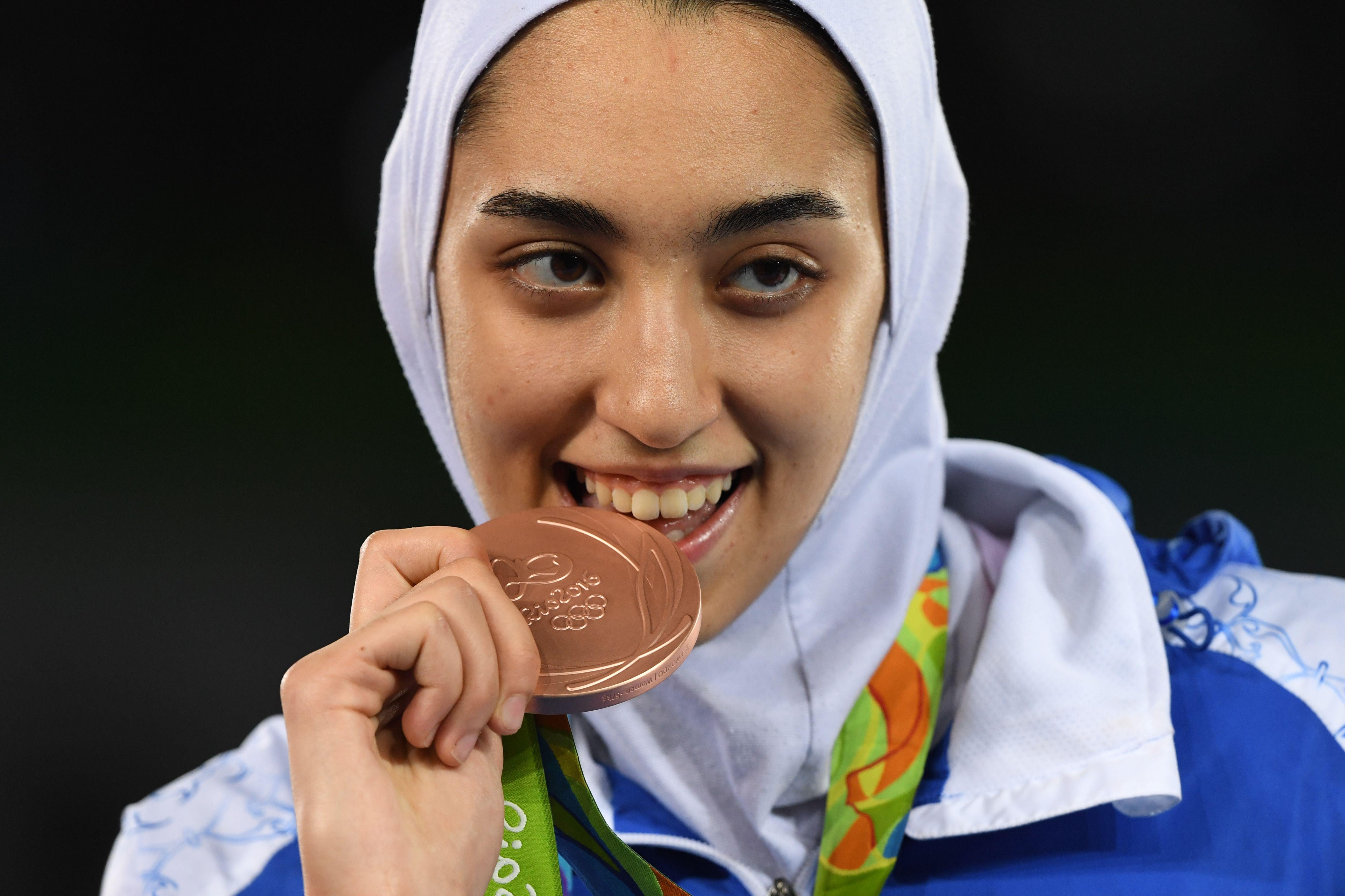 Iran's Kimia Alizadeh Zenoorin poses with her bronze medal on the podium after the womens taekwondo event in the -57kg category as part of the Rio 2016 Olympic Games, on August 18, 2016, at the Carioca Arena 3, in Rio de Janeiro. 