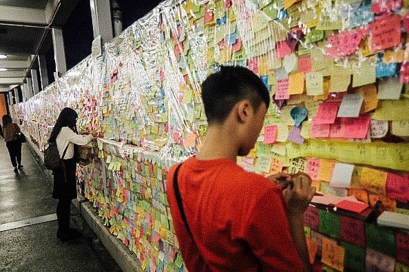 Residents view the protest-themed Post-It Notes.