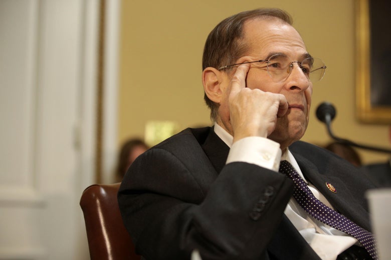 Rep. Jerrold Nadler presses his hand to his face as he listens at a meeting at the U.S. Capitol.