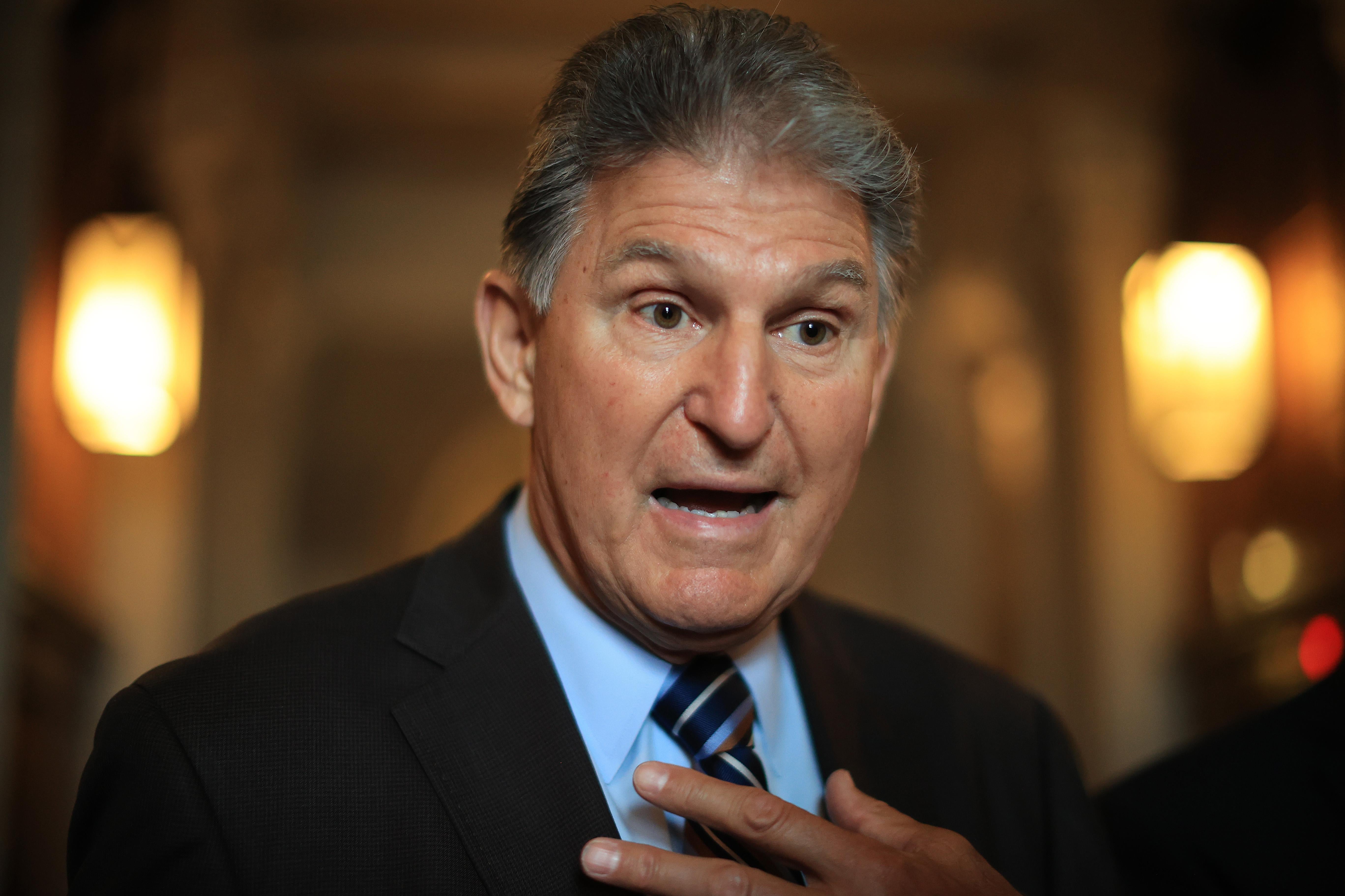 Sen. Joe Manchin (D-WV) talks with reporters after stepping off the Senate Floor at the U.S. Capitol on May 28, 2021 in Washington, D.C.