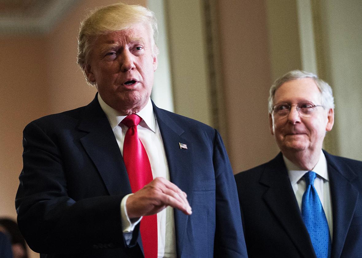 US President-elect Donald Trump speaks to the press with Senate Majority Leader Mitch McConnell following a meeting at the Capitol in Washington, DC, on November 10, 2016.