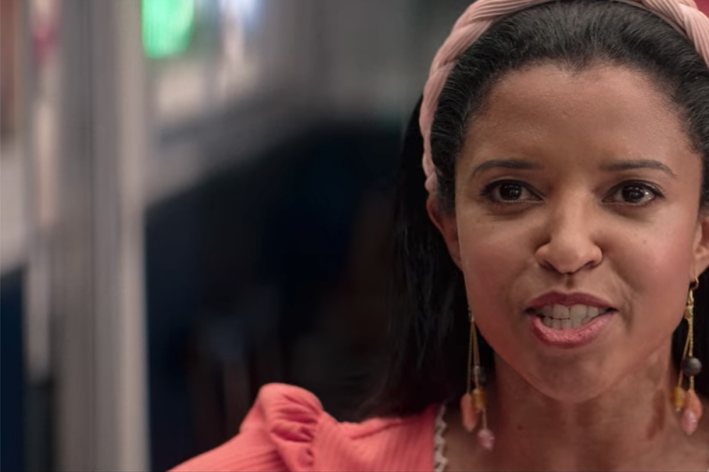 Renée Elise Goldsberry looks past the camera singing.