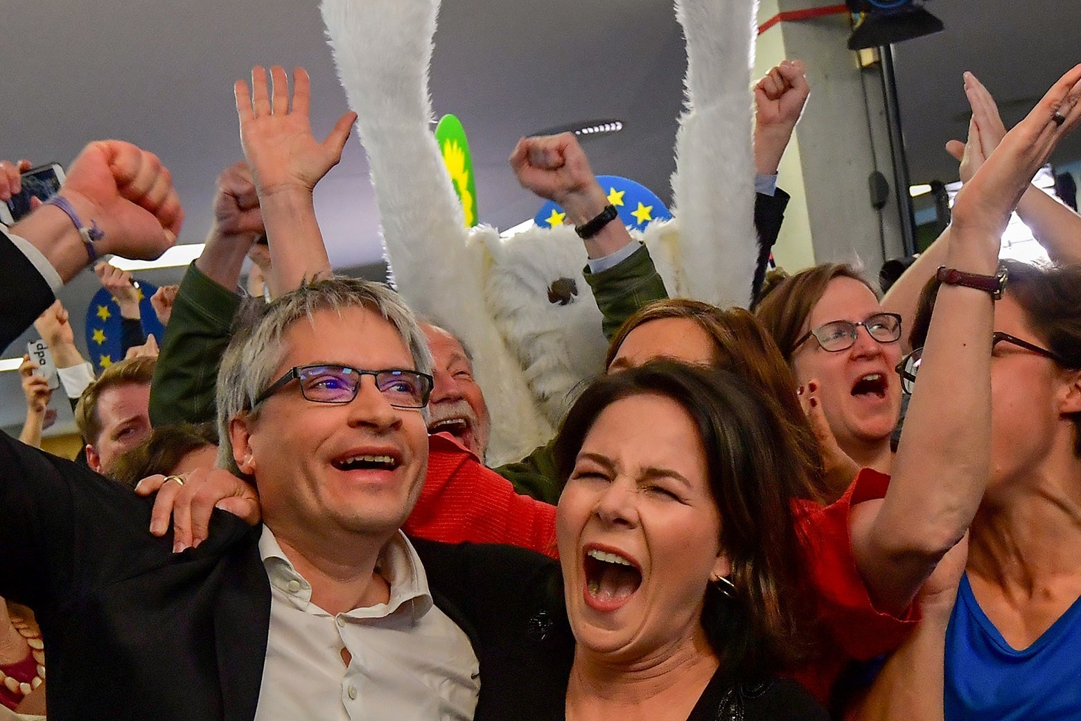 German Greens party top candidate Sven Giegold and party leader Annalena Baerbock celebrate.