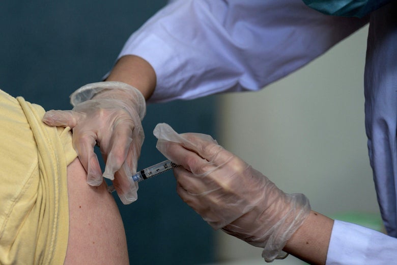 A vaccination being administered.