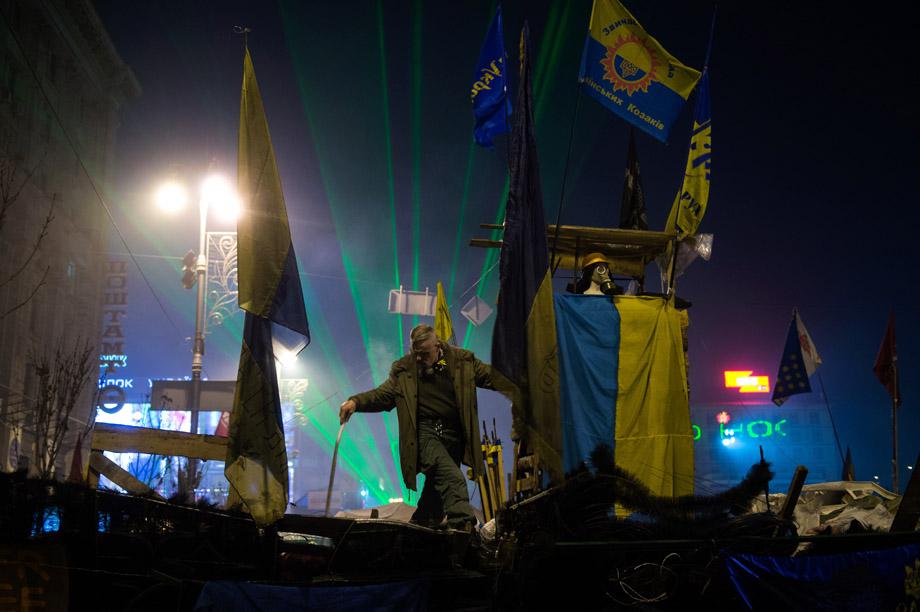 A protester stands on a barricade in Kiev on Feb. 15, 2014. 