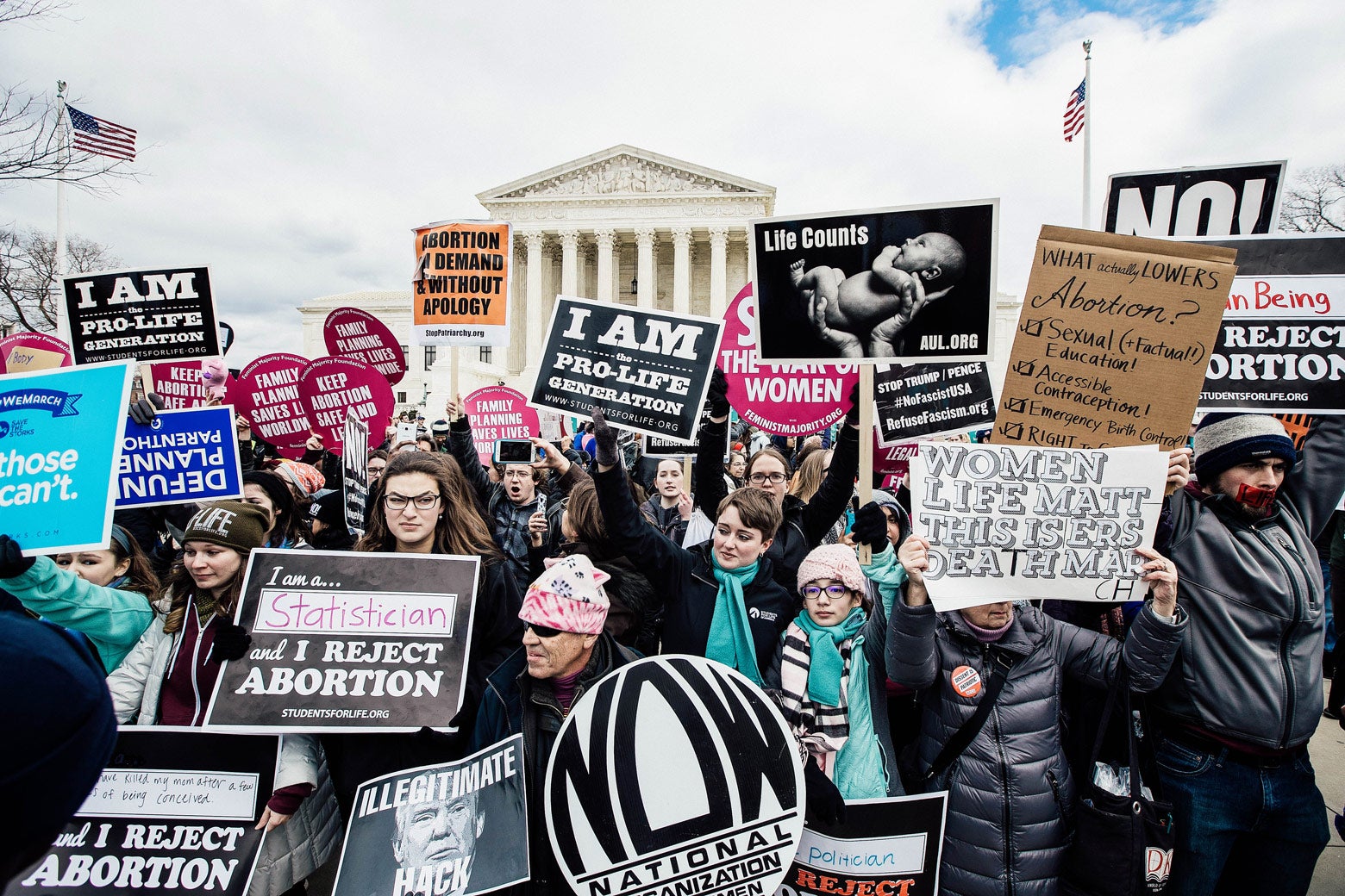 A mix of anti-abortion advocates and pro-choice advocates rally outside of the Supreme Court during the March for Life.