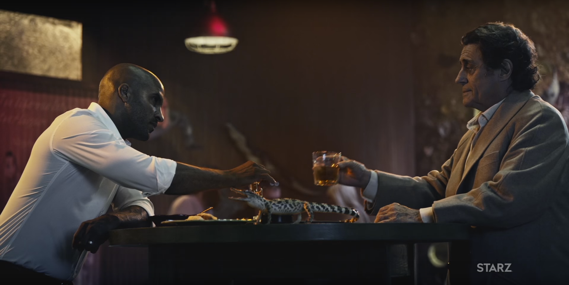 Shadow (Ricky Whittle) and Mr. Wednesday (Ricky Whittle) in the trailer for American Gods.