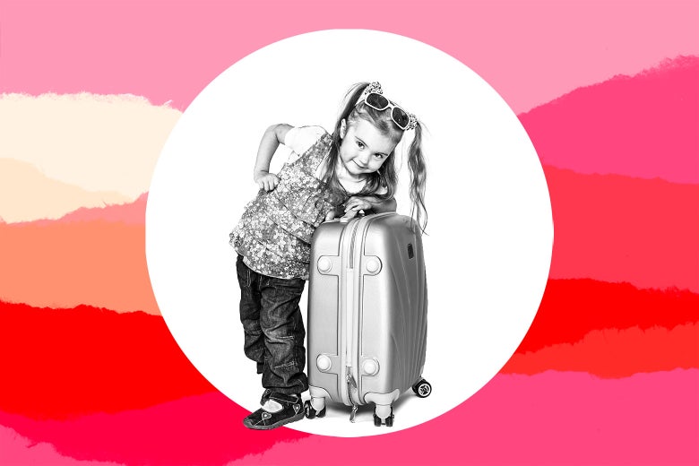 A young girl leans on a suitcase.