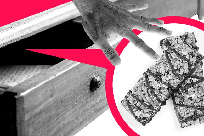 An open drawer w/ granola bars and a hand reaching for them.
