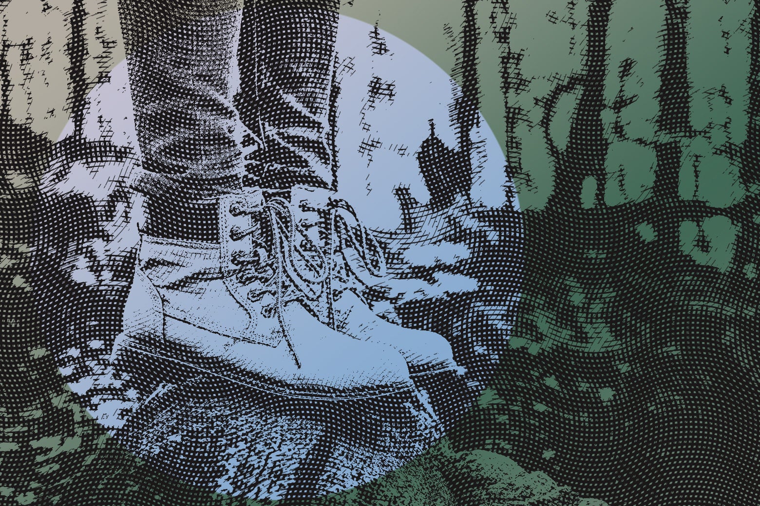 A person wearing boots standing in the middle of the woods.