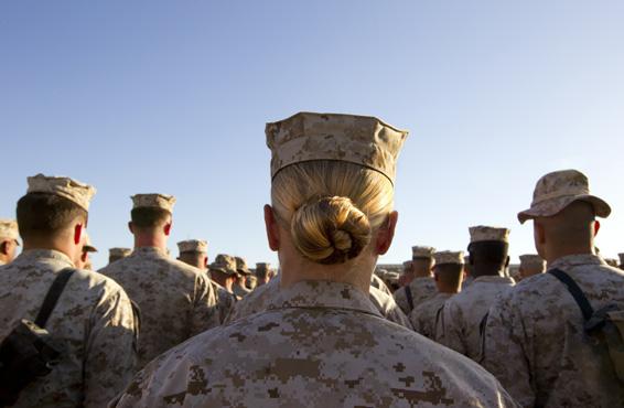 Sargent Crystal Groves US Marine with the FET (Female Engagement Team) 1st Battalion 8th Marines, Regimental Combat team II stands in formation during a ceremony for the 235th birthday of the Marines on November 10, 2010 at Camp Delaram in Helmand province, Afghanistan. 