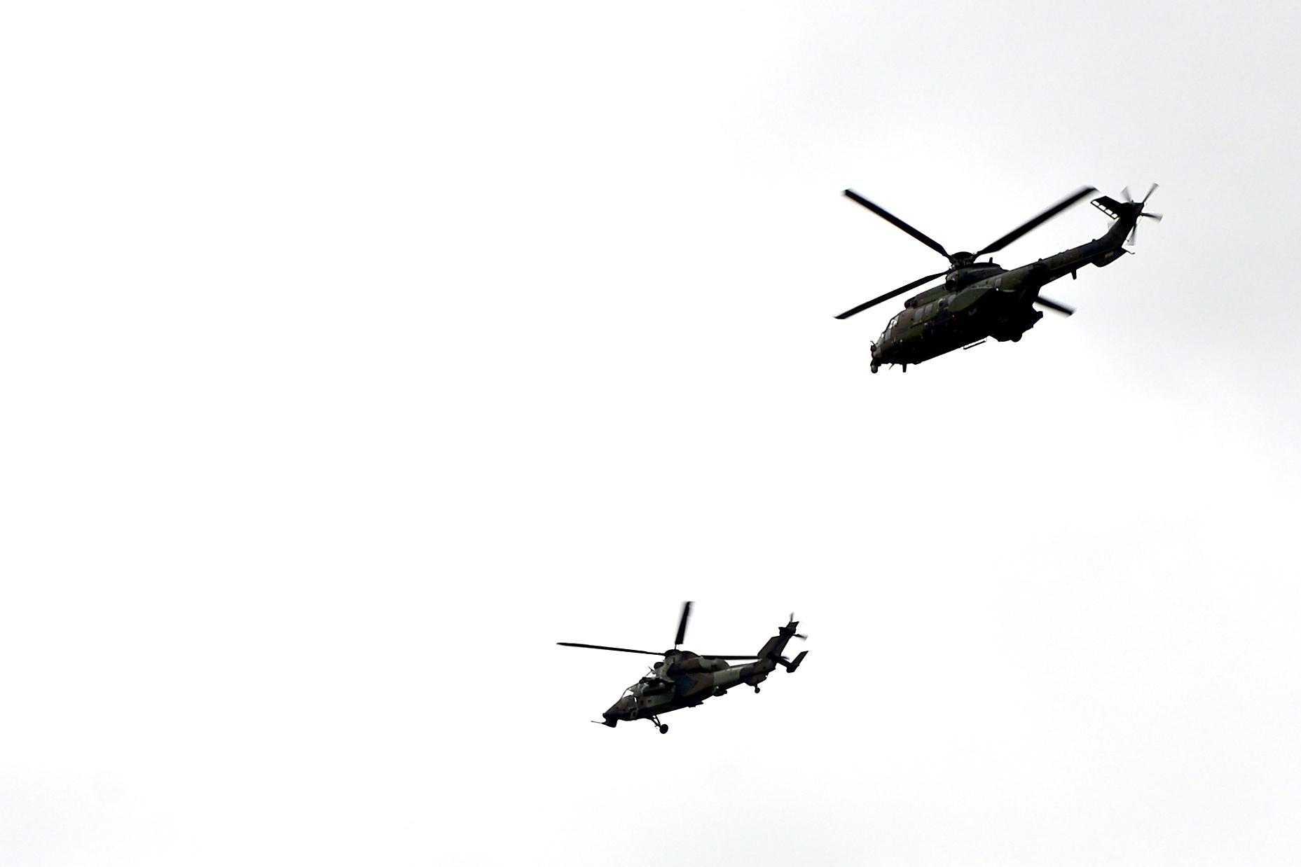 French Army helicopters fly past during a ceremony of seven French soldiers of the 5th RHC (Fighter Helicopter Regiment) died in a helicopter collision in Mali, in Pau-Uzein on December 03 2019, southwestern France. - The soldiers died when two helicopters collided last Monday while pursuing jihadists in northern Mali, where militant violence has soared in recent months. (Photo by Iroz Gaizka / AFP) (Photo by IROZ GAIZKA/AFP via Getty Images)