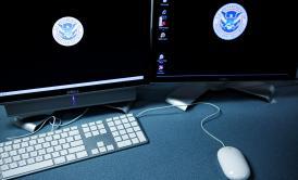 The logos of the U.S. Department of Homeland Security are seen on computer terminals in a training room of the Cyber Crimes Center of U.S. Immigration and Customs Enforcement Oct. 13, 2009, in Fairfax, Va.