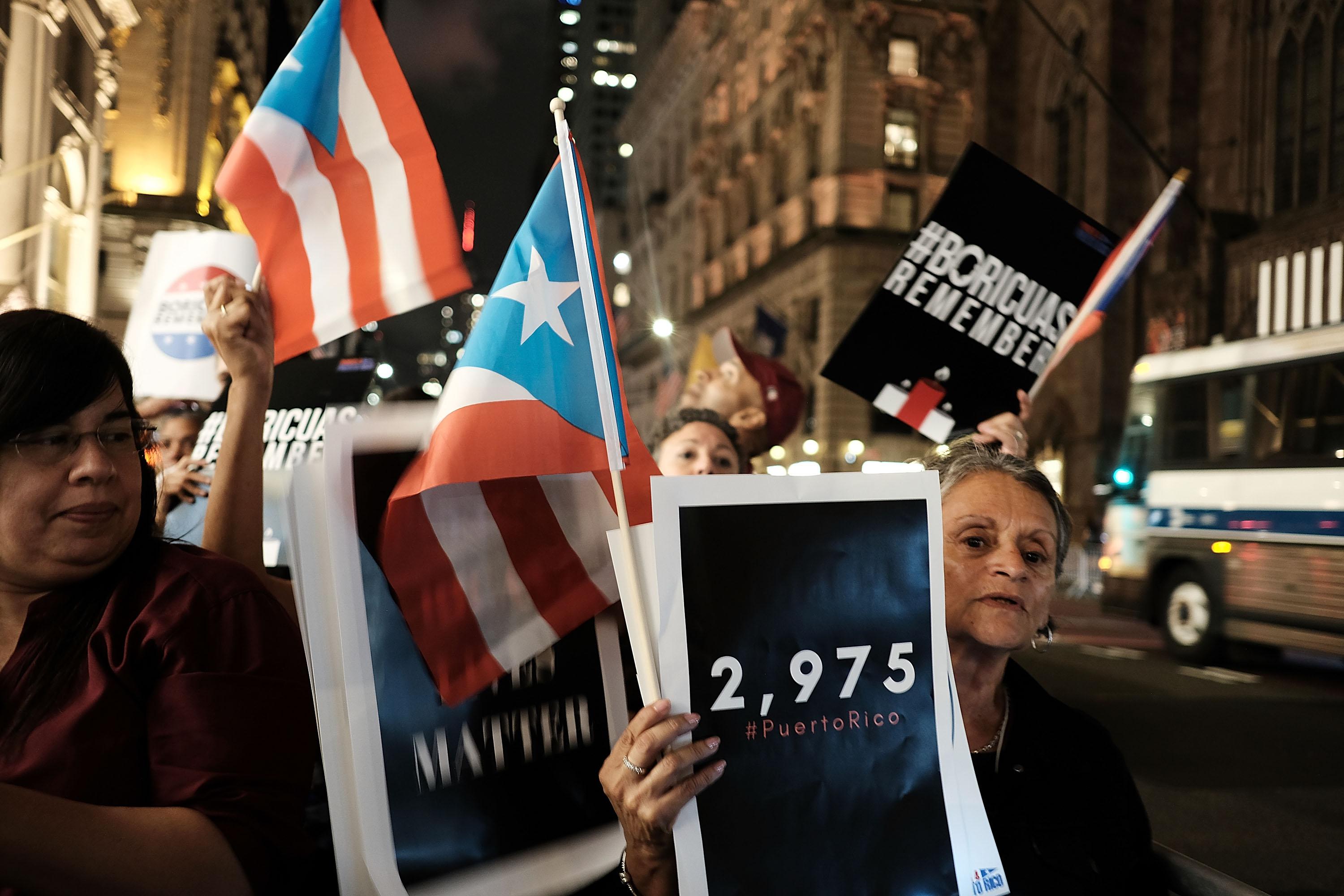 People march to Trump Tower following a service at St. Bartholomew's Church for the one year anniversary of Hurricane Maria on September 20, 2018 in New York, New York. The evening service sought to celebrate and remember the lives of the nearly 3,000 people who died as a result of Hurricane Maria.