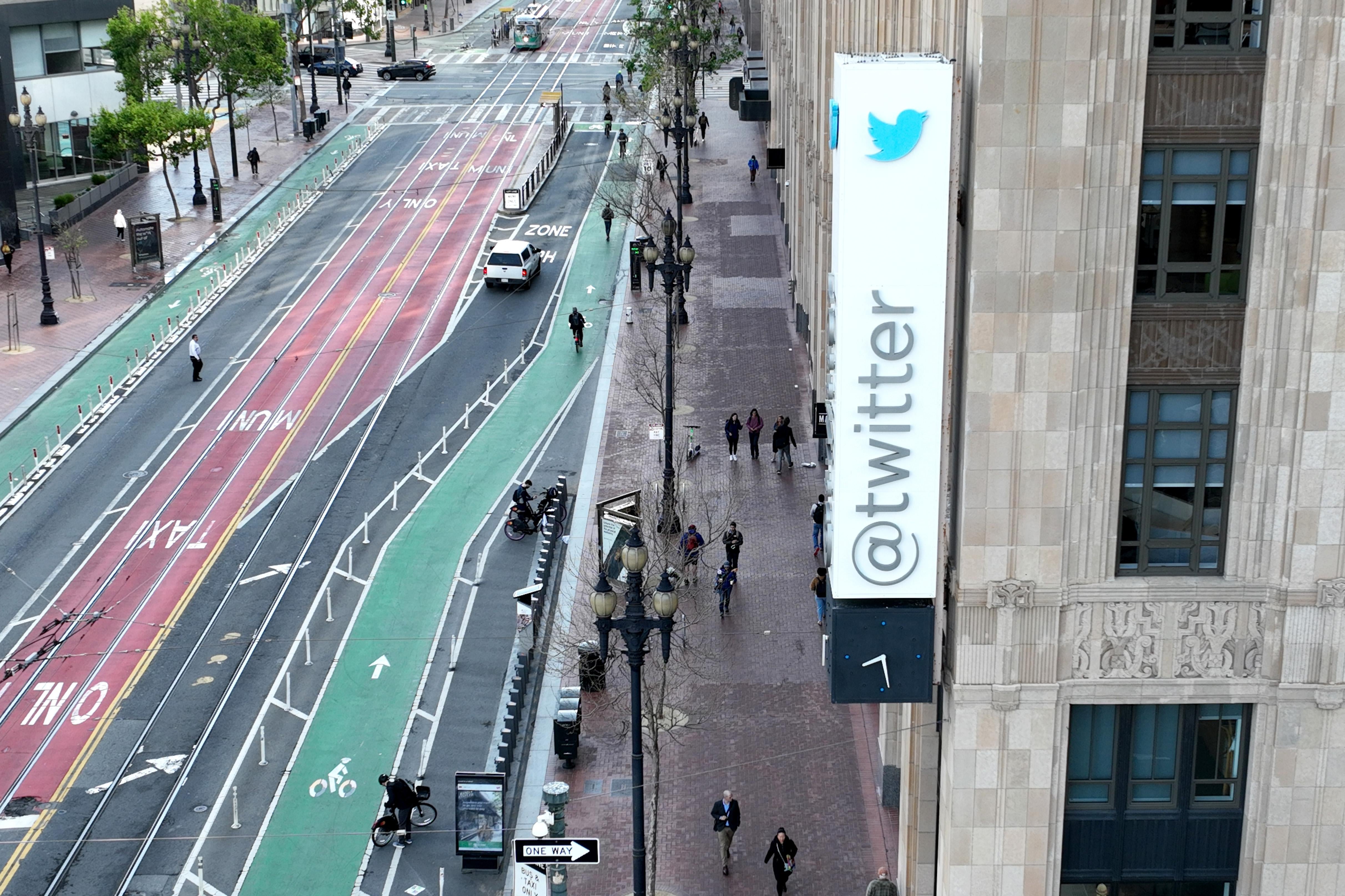 A downtown building with a sign that says @twitter