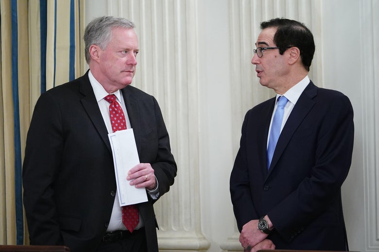 Chief of Staff Mark Meadows (L) speaks with US Secretary of the Treasury Steve Mnuchin before US President Donald Trump meets with Republican members of the US Congress in the State Dining Room of the White House in Washington, DC, on May 8, 2020. (Photo by MANDEL NGAN / AFP) (Photo by MANDEL NGAN/AFP via Getty Images)