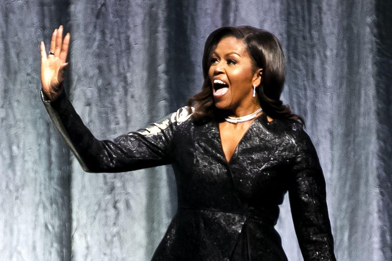 Former First Lady Michelle Obama gestures as he stands on stage to speak at the Ziggo Dome in Amsterdam on April 17, 2019.