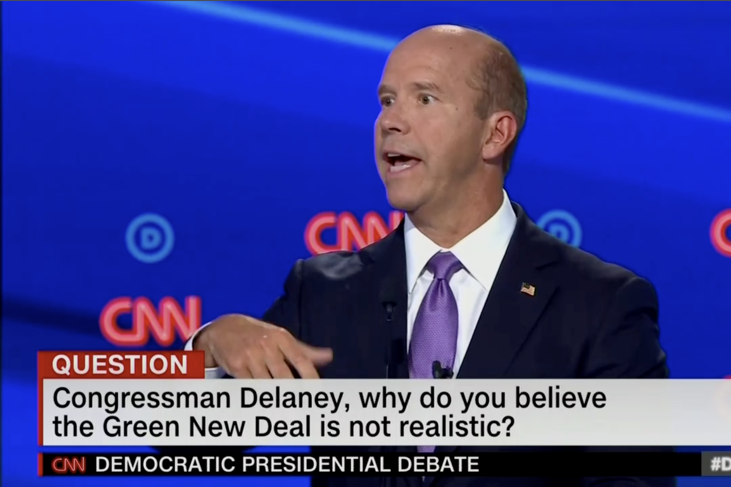 In this screengrab from CNN, Tom Delaney debates. The banner reads: "Congressman Delaney, why do you believe the Green New Deal is not realistic?"