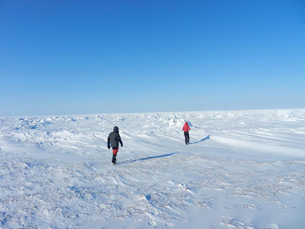 Dark patches on the snow are visible when you walk out onto a frozen Hudson Bay.