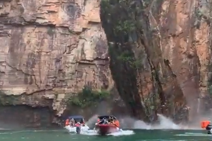 A screengrab from a video published on social media shows the moment the rock formation fell onto boats at Furnas lake in the state of Minas Gerais, Brazil on Jan. 8, 2022.