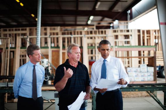 President Obama and Housing Secretary Shaun Donovan (L) tour Erickson Construction on August 6, 2013 in Chandler, Arizona.  