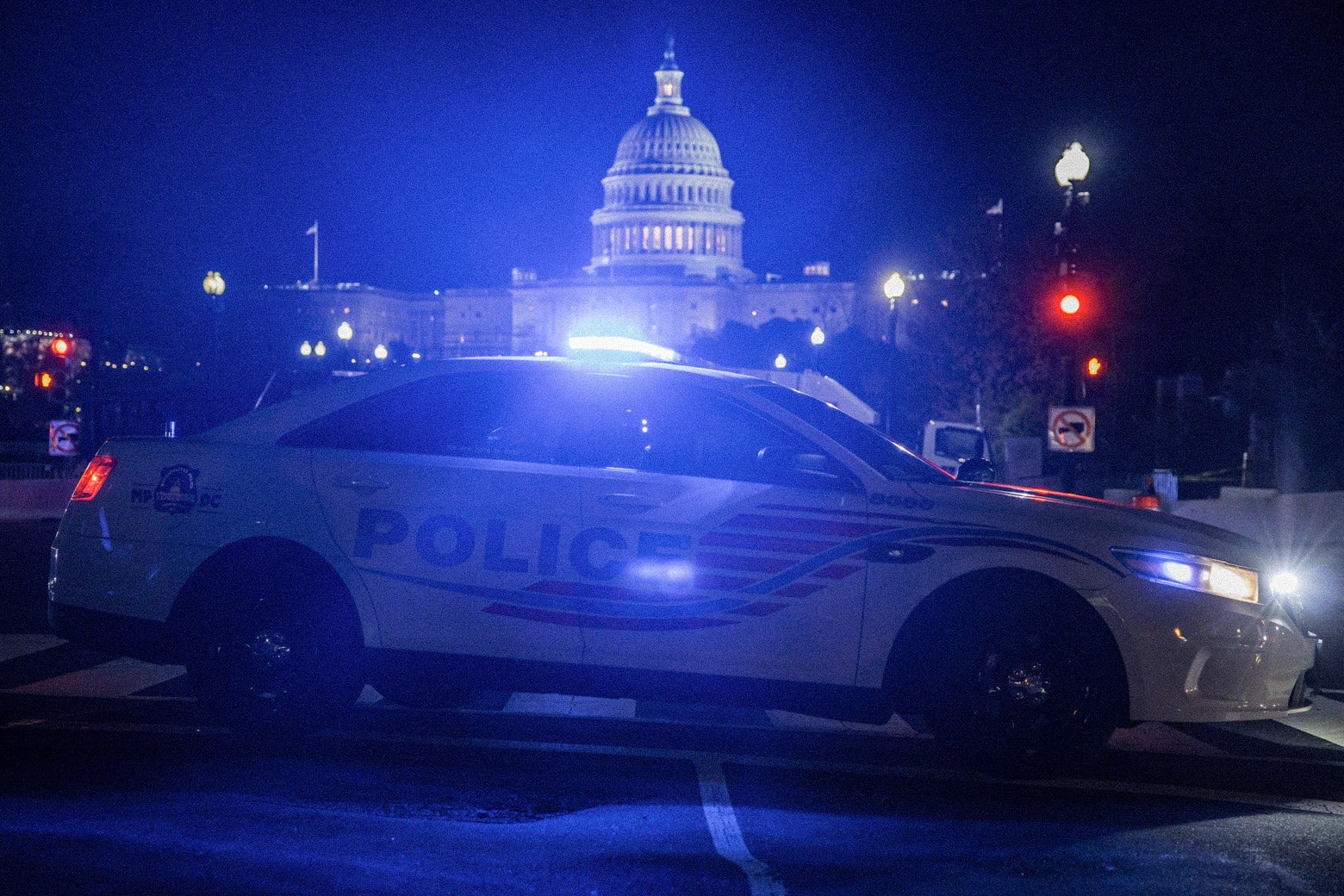 A police car blocks off a street near the U.S. Capitol building