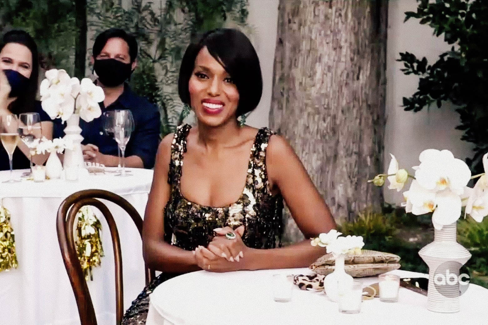 Kerry Washington sits at a table.
