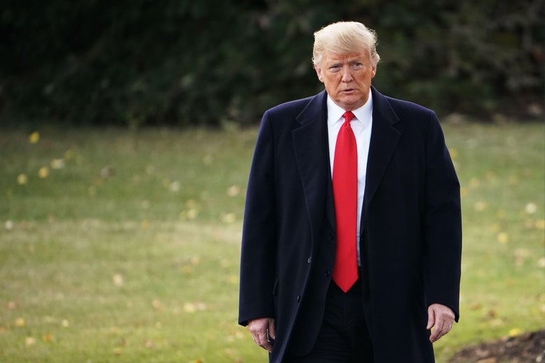 President Trump walks before boarding Marine One on the South Lawn of the White House in Washington, DC.