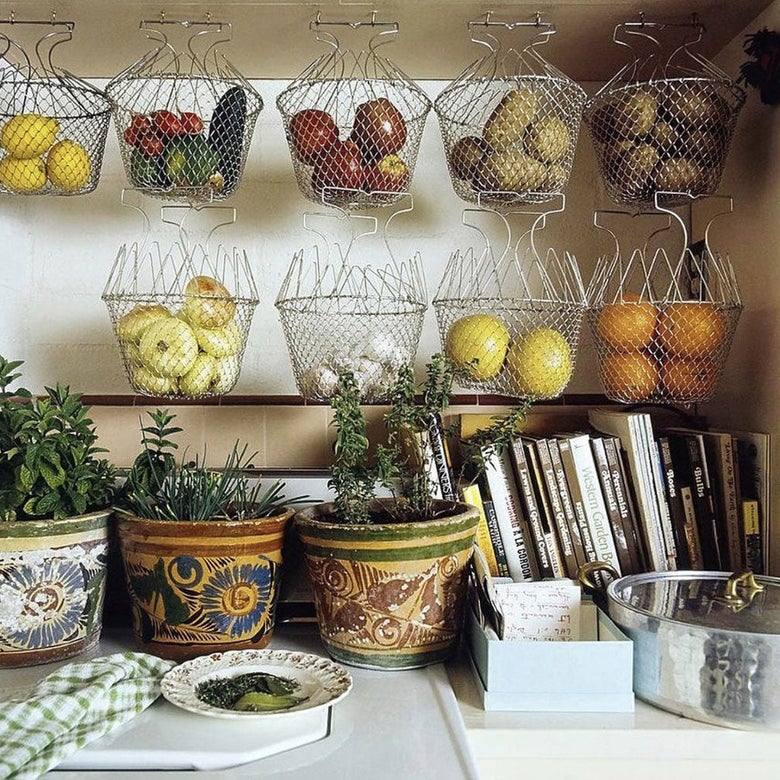 Photo of a counter with baskets and plants.