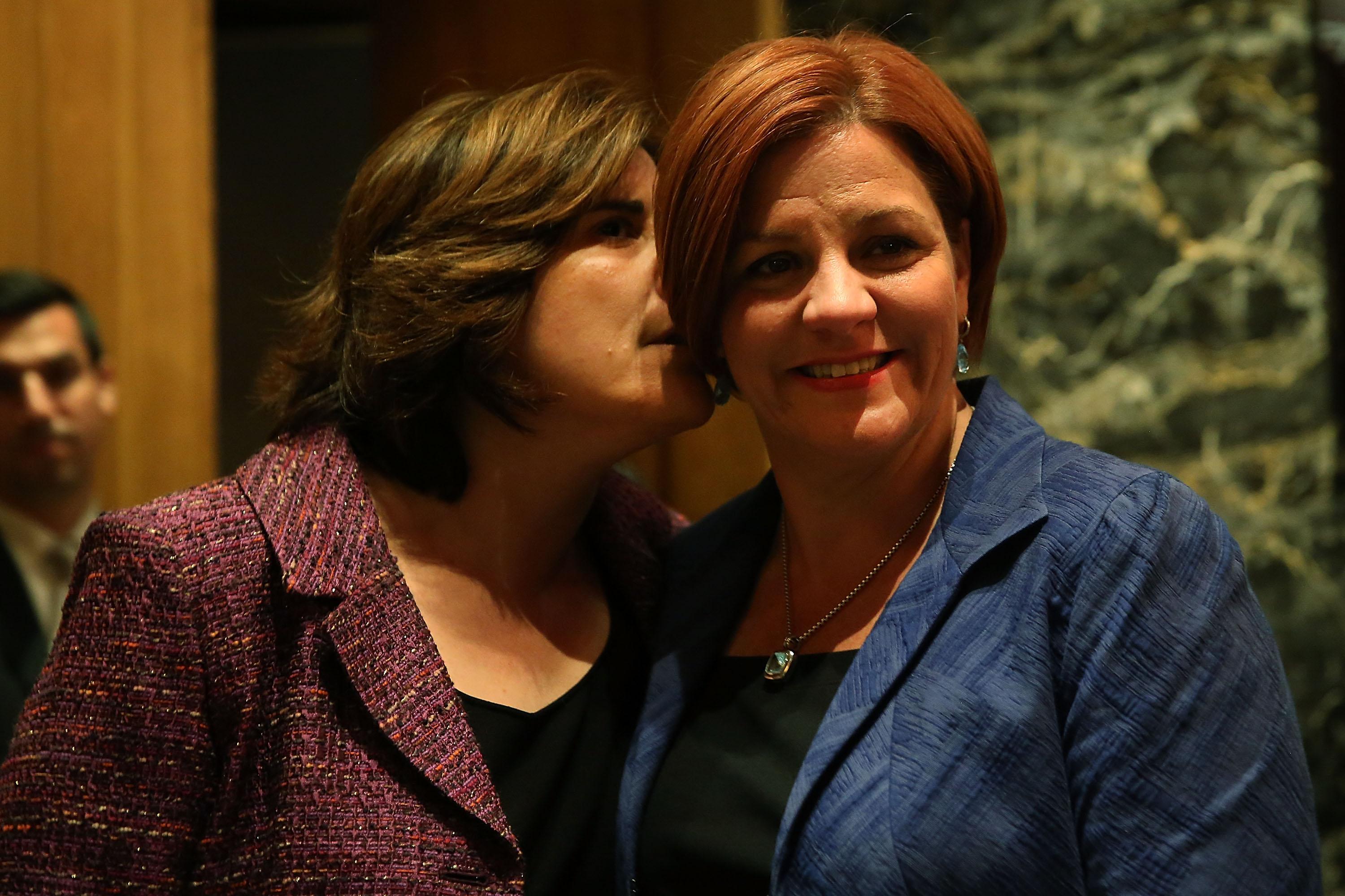 NEW YORK, NY - SEPTEMBER 10: New York City Council Speaker Christine Quinn (R) stands backstage with her wife Kim Catullo moments before conceding defeat in the New York Democratic mayoral primary elections on September 10, 2013 in New York City. Quinn, who lead early in the polls and who was endorsed by all of New York's major newspapers, saw her lead slip away in the final weeks of the campaign. Quinn would have been the first woman and lesbian to hold the job of mayor. (Photo by Spencer Platt/Getty Images)