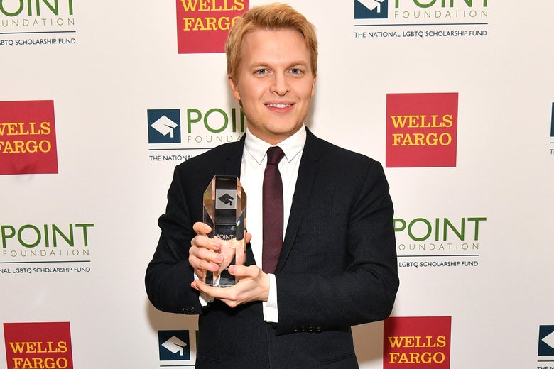 Ronan Farrow poses with an award at The Plaza Hotel on April 9, 2018 in New York City.