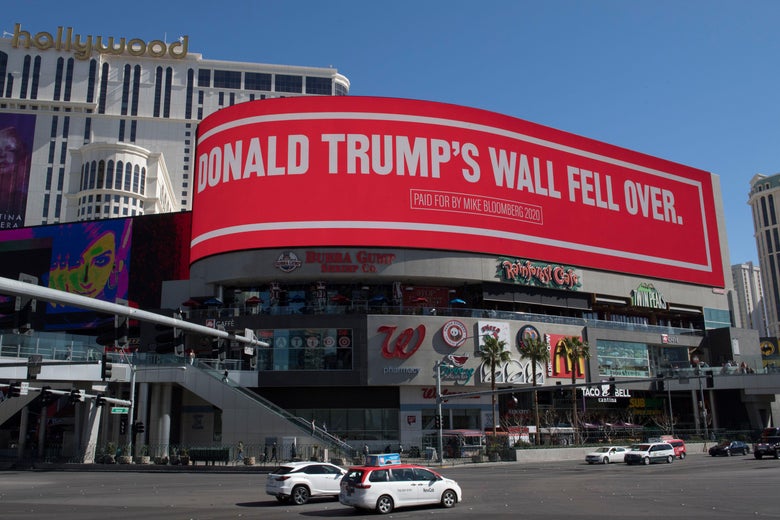 A third billboard paid for Bloomberg says Trump's wall fell over.