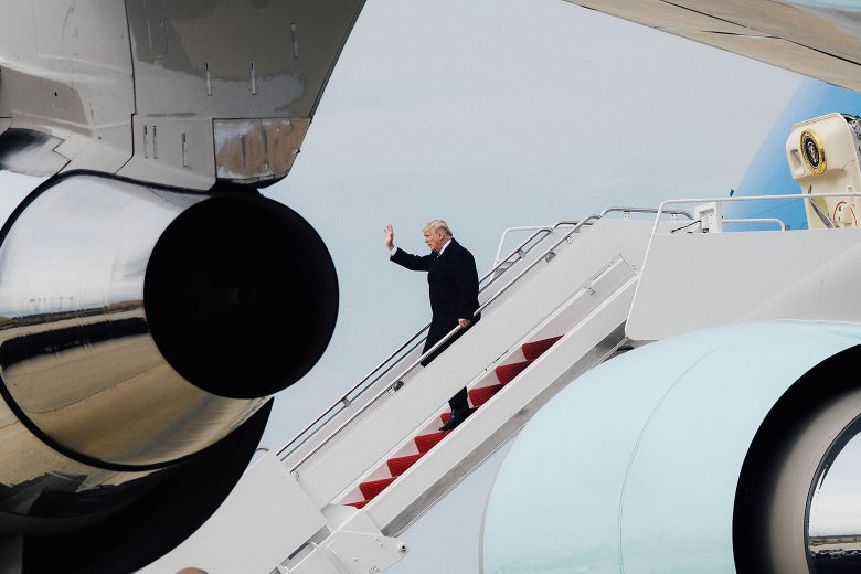 U.S. President Donald Trump disembarks from Air Force One upon arrival at Joint Base Andrews in Maryland on April 22.