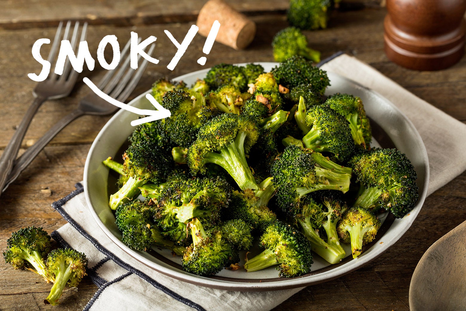 A dish of broccoli florets seasoned with pimentón de la Vera, with the word "SMOKY!" hovering over it.