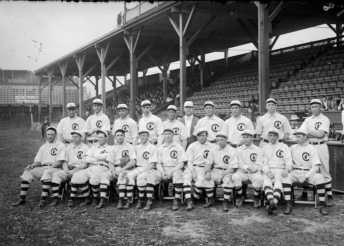 Group portrait of National League's Chicago Cubs baseball team players, World Champions 1908, posing for a photograph on the field at West Side Grounds, Chicago, Illinois, 1908. 