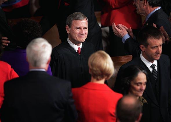 Supreme Court Chief Justice John Roberts arrives in the House Chamber before U.S. President Barack Obama delivers the State of the Union address to a joint session of Congress at the U.S. Capitol on January 28, 2014 in Washington, DC. 