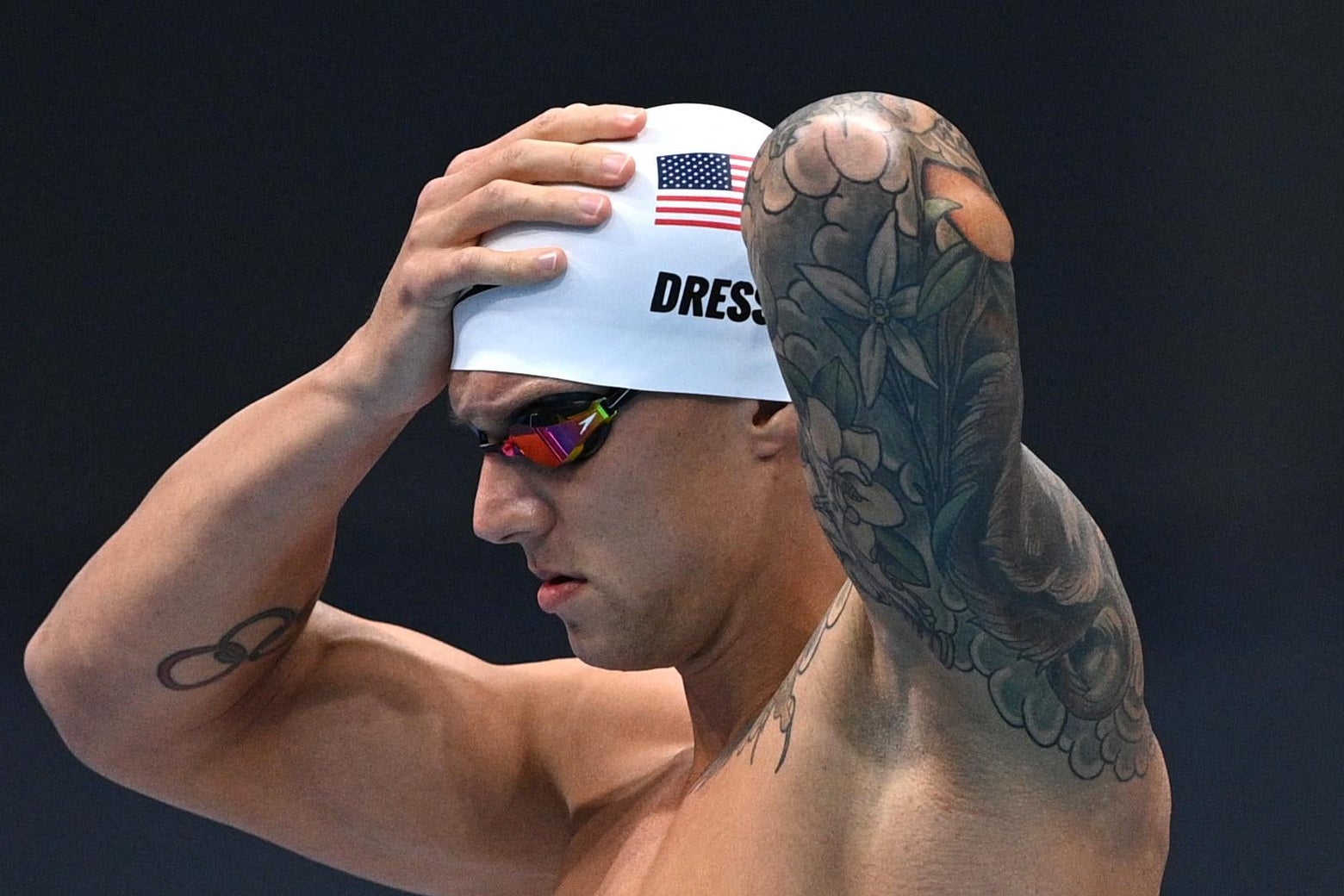 Olympic gold medal angel tattoo located on Devin