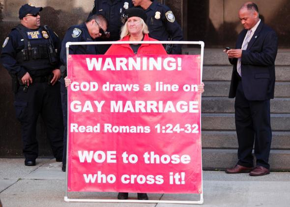 A protester outside a Detroit hearing supports Michigan's ban on same-sex marriage.