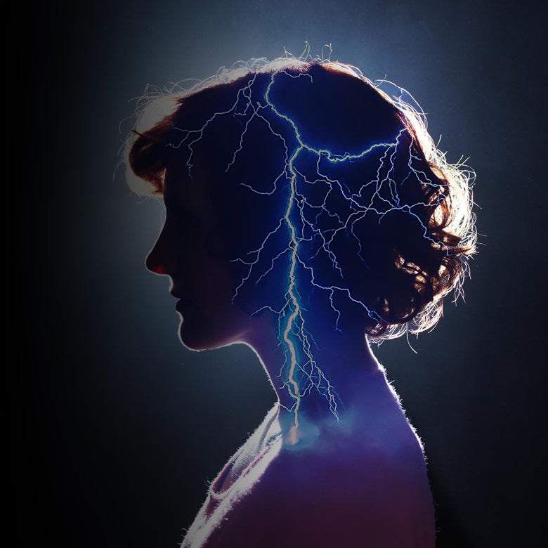 Woman in profile with lightning going through her head
